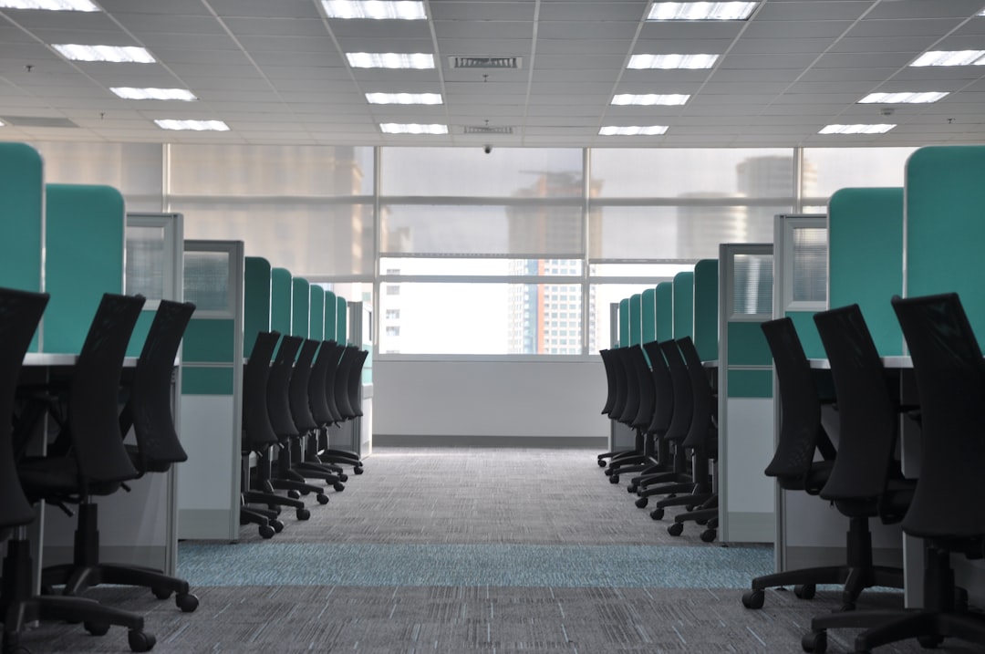 services-05 empty-black-rolling-chairs-at-cubicles-2zzp12chxhu